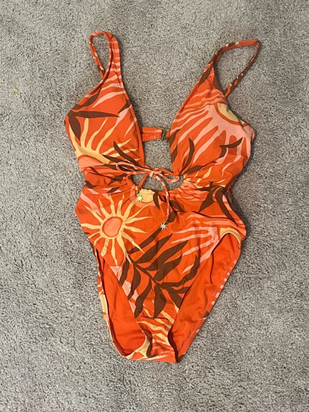 Sanctuary cut outs and sun beads on the tie one piece swimsuit size M